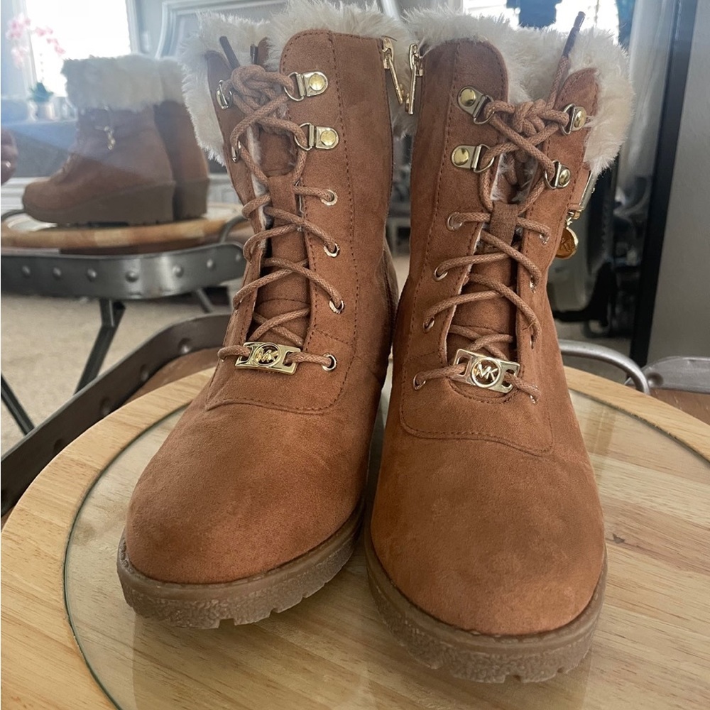 Michael Kors Girls faux fur boots. Wedge Like new. Size 4 wears like a women’s 6